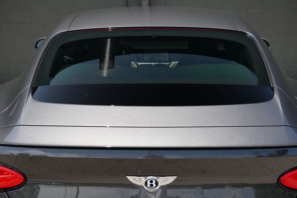 anthracite 6k-mile 2021 Bentley Continental GT W12 sold by Sandbox Motors